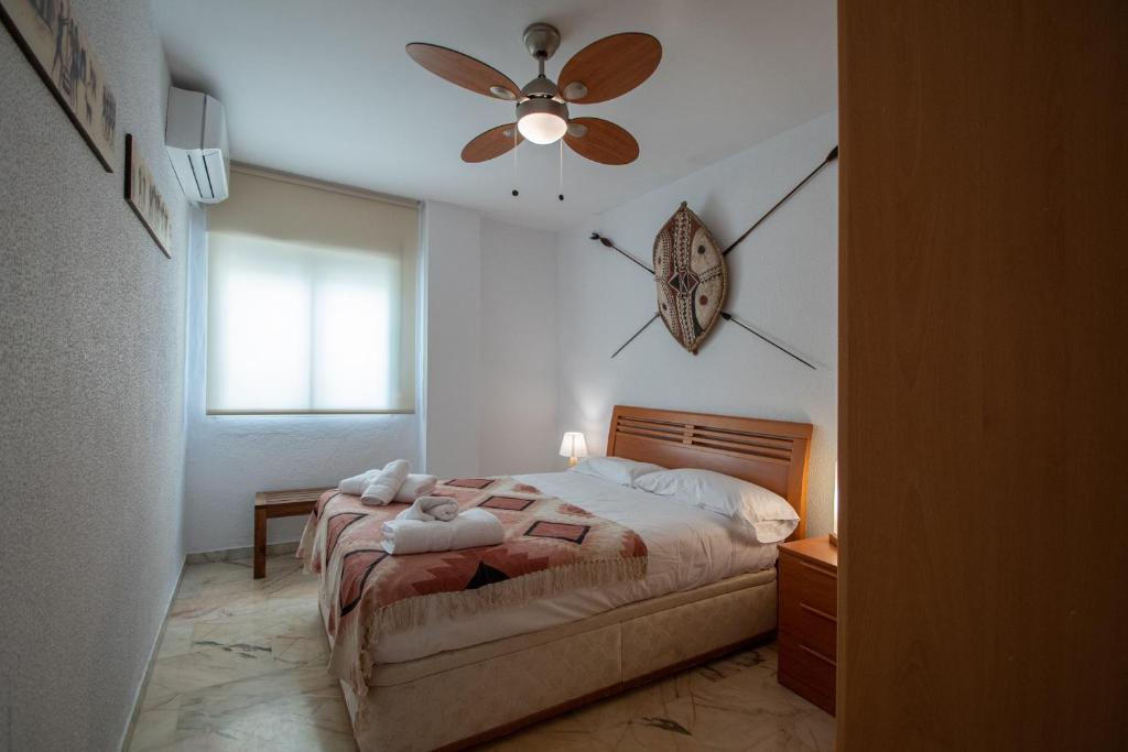 Posteľ alebo postele v izbe v ubytovaní Apartamento Tribalia Cadiz