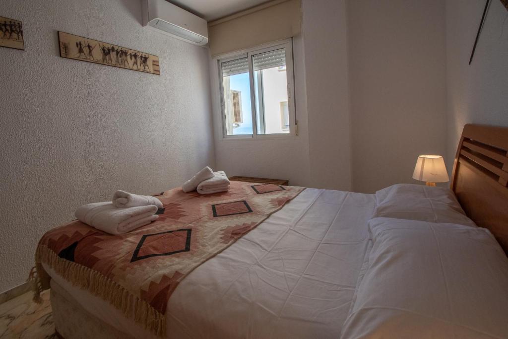 Posteľ alebo postele v izbe v ubytovaní Apartamento Tribalia Cadiz