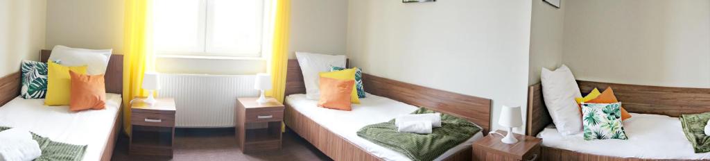 Postel nebo postele na pokoji v ubytování Garden Zajazd