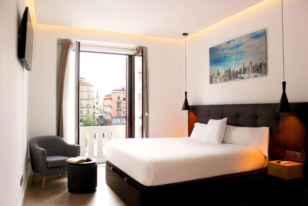 Postel nebo postele na pokoji v ubytování Woohoo Rooms Boutique Gran Vía