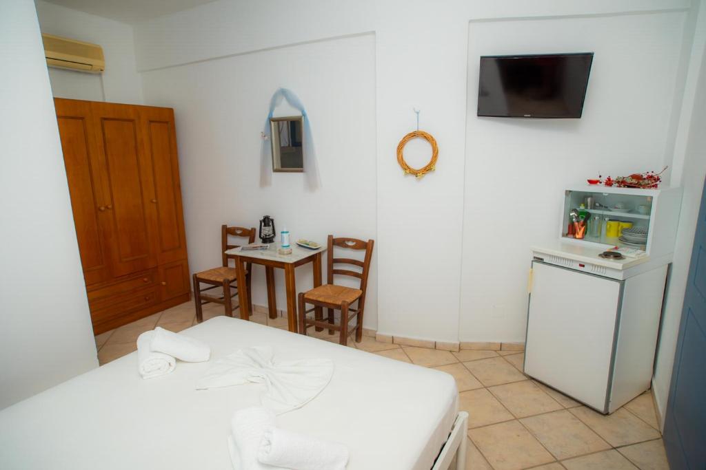 Kuchyň nebo kuchyňský kout v ubytování Manos Rooms