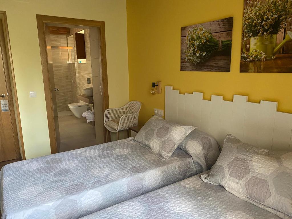 Postel nebo postele na pokoji v ubytování Casa da Cota