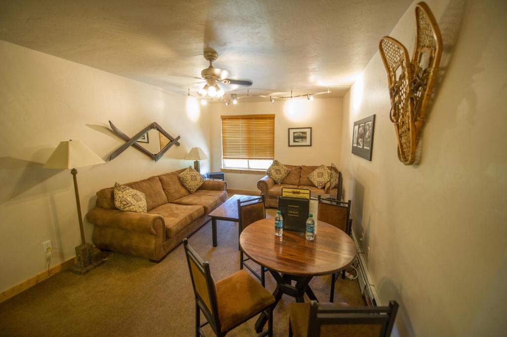 a living room with a couch and a table at Located At Base Of The Magnificent Mt Quandary in Breckenridge
