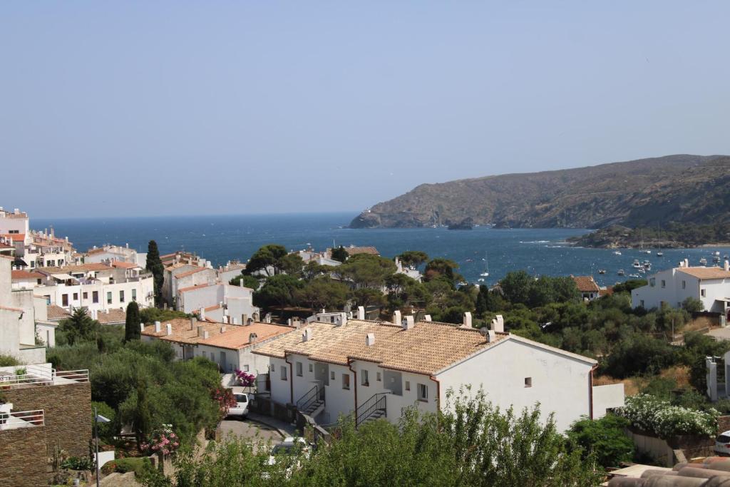 a view of a town on a hill with houses at Attic in Cadaques in Cadaqués