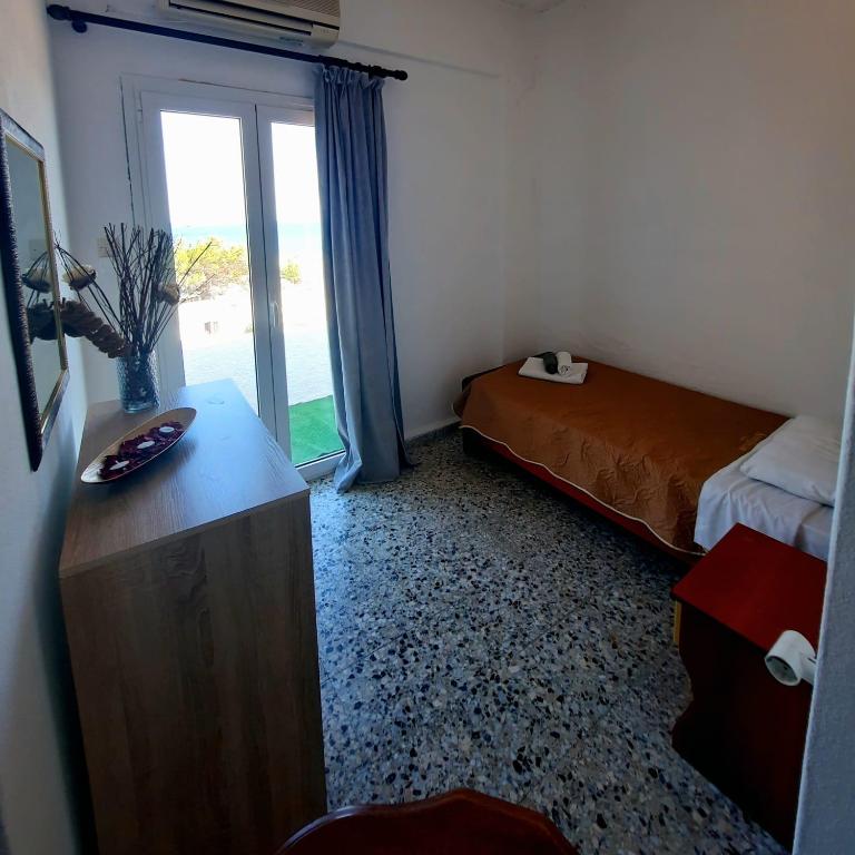 Postel nebo postele na pokoji v ubytování Paradise