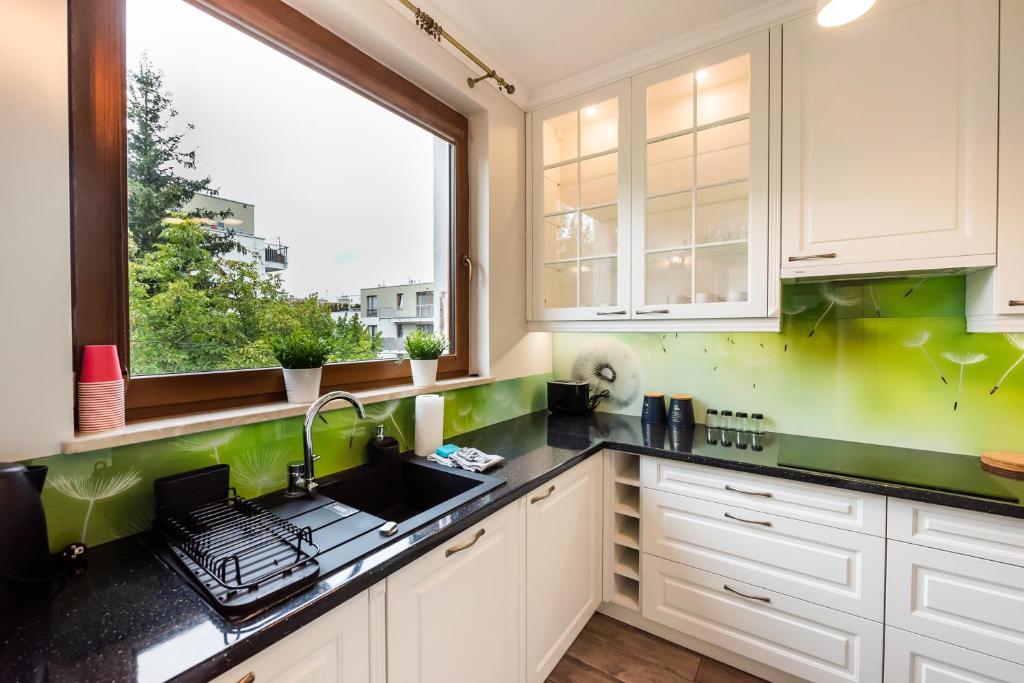 Kuchyňa alebo kuchynka v ubytovaní Prestige Verdant Apartment