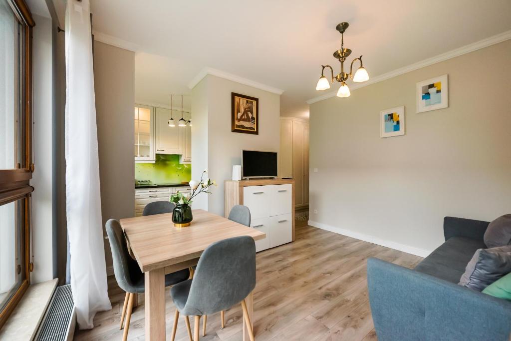 Televízia a/alebo spoločenská miestnosť v ubytovaní Prestige Verdant Apartment