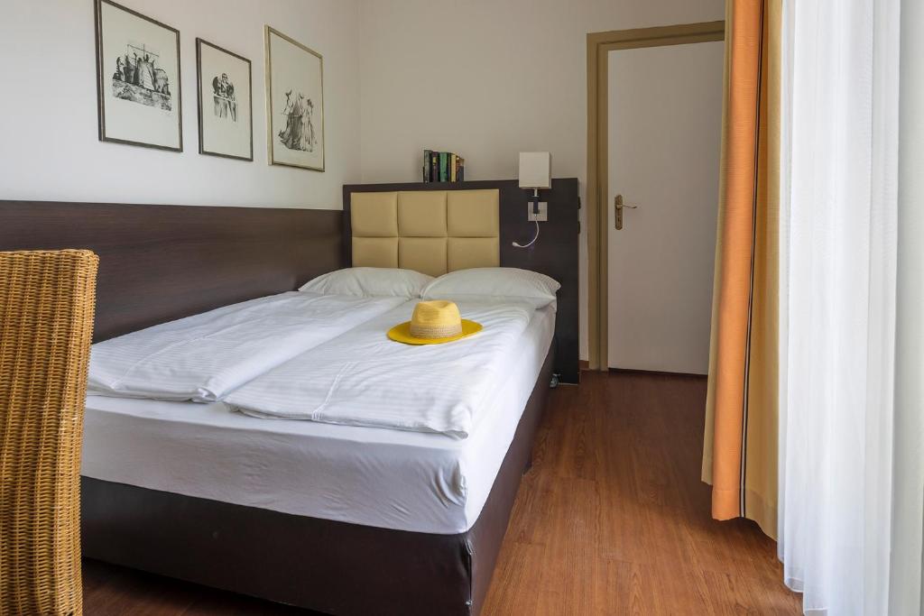 Postel nebo postele na pokoji v ubytování Hotel Minerva