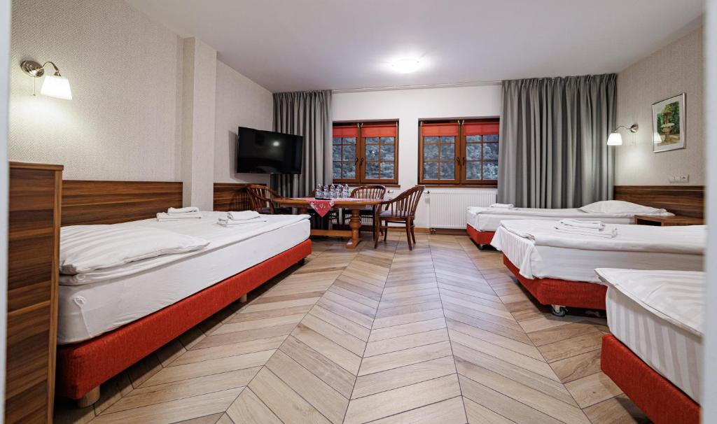 Posteľ alebo postele v izbe v ubytovaní Leśne Patio