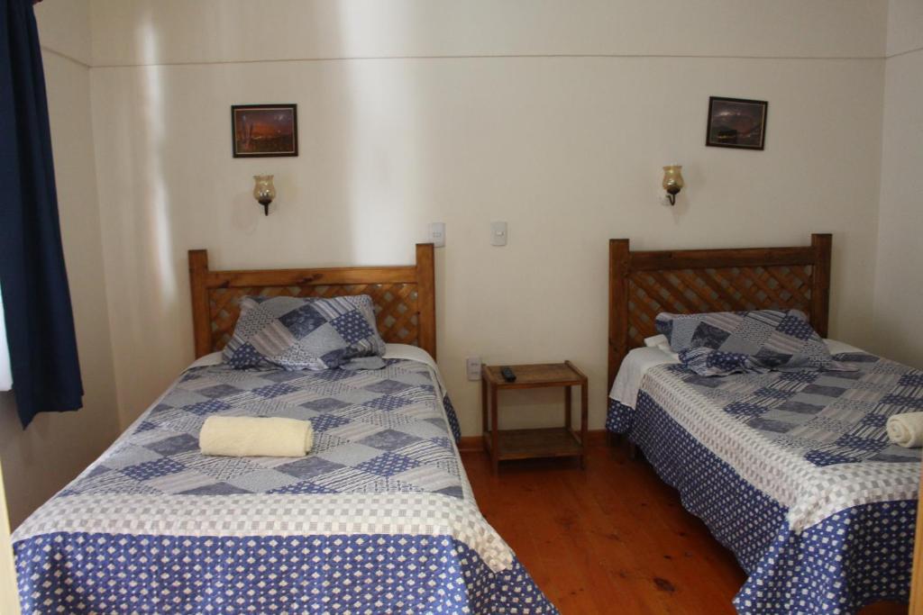 Postel nebo postele na pokoji v ubytování Hostal Michel