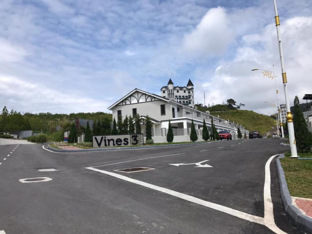 a white building on the side of a road at New 2 storey-Majestic Homestay 3 min to Night Market in Brinchang