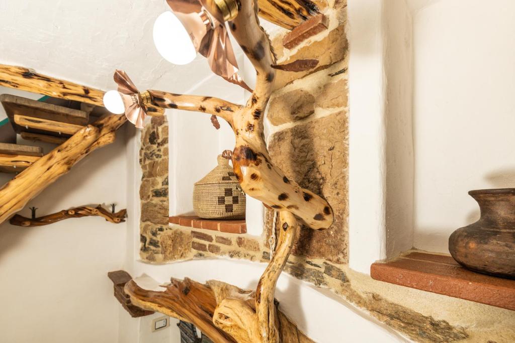 Fotografie z fotogalerie ubytování Sa dommu de su maistru 'e linna _SA SCANCìA_ v destinaci Baunei