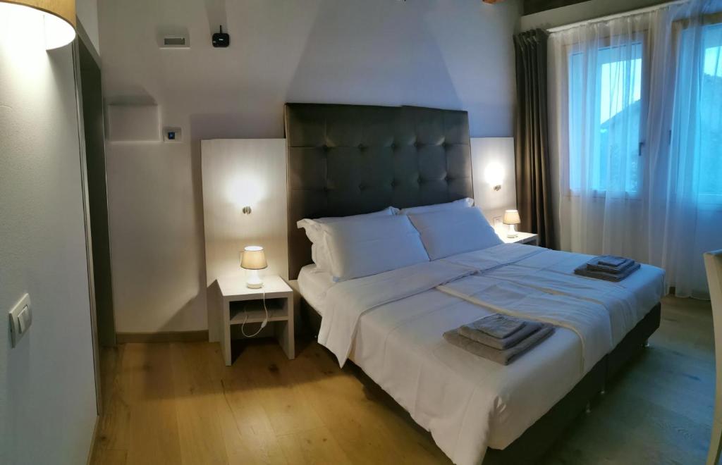 Posteľ alebo postele v izbe v ubytovaní Casa BORRIERO Farmhouse Charme B&B