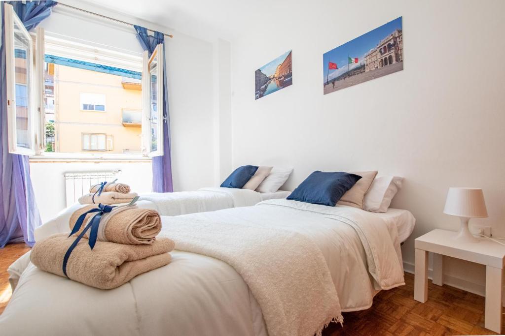 Posteľ alebo postele v izbe v ubytovaní FREE PARKING -6 posti letto e Terrazzo vista mare