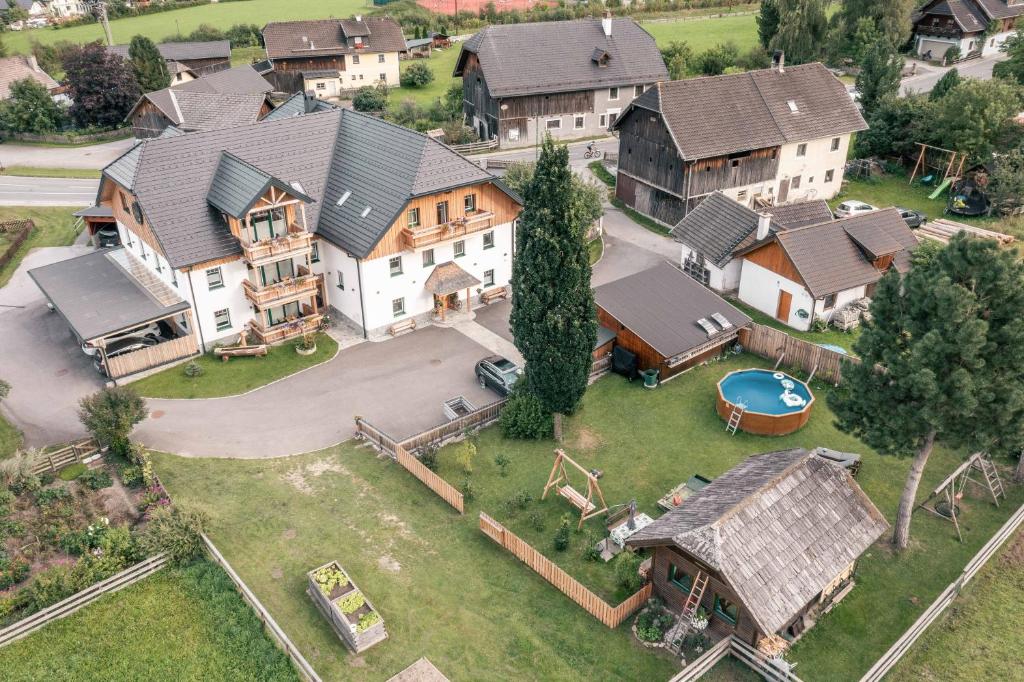 an aerial view of a large house with a yard at Landhaus Holzer in Sankt Margarethen im Lungau