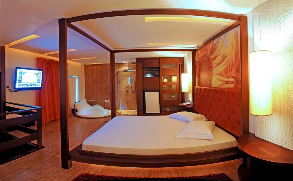 Postel nebo postele na pokoji v ubytování Gran Motel Dubai