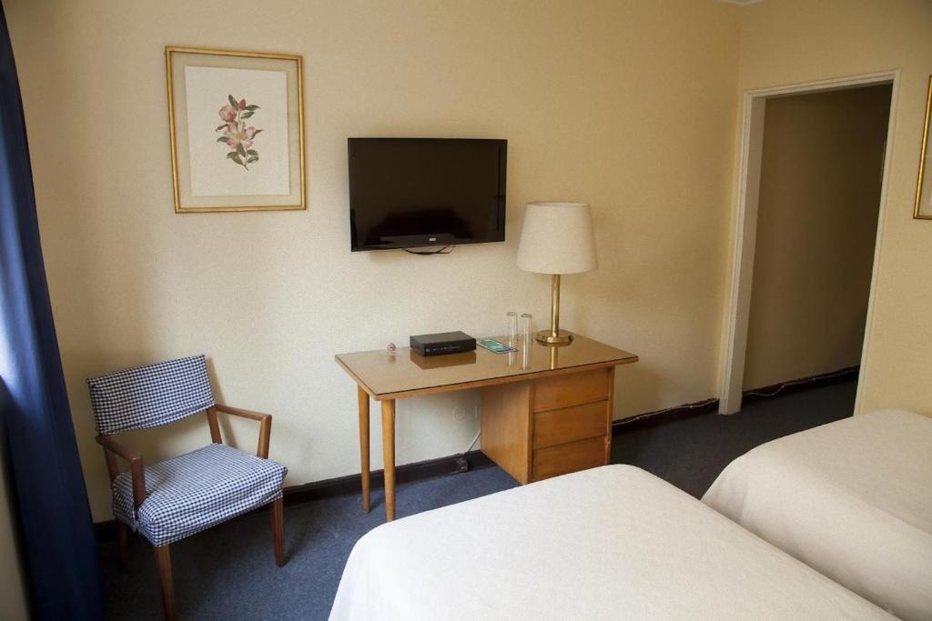 TV a/nebo společenská místnost v ubytování Hotel Santa Lucia