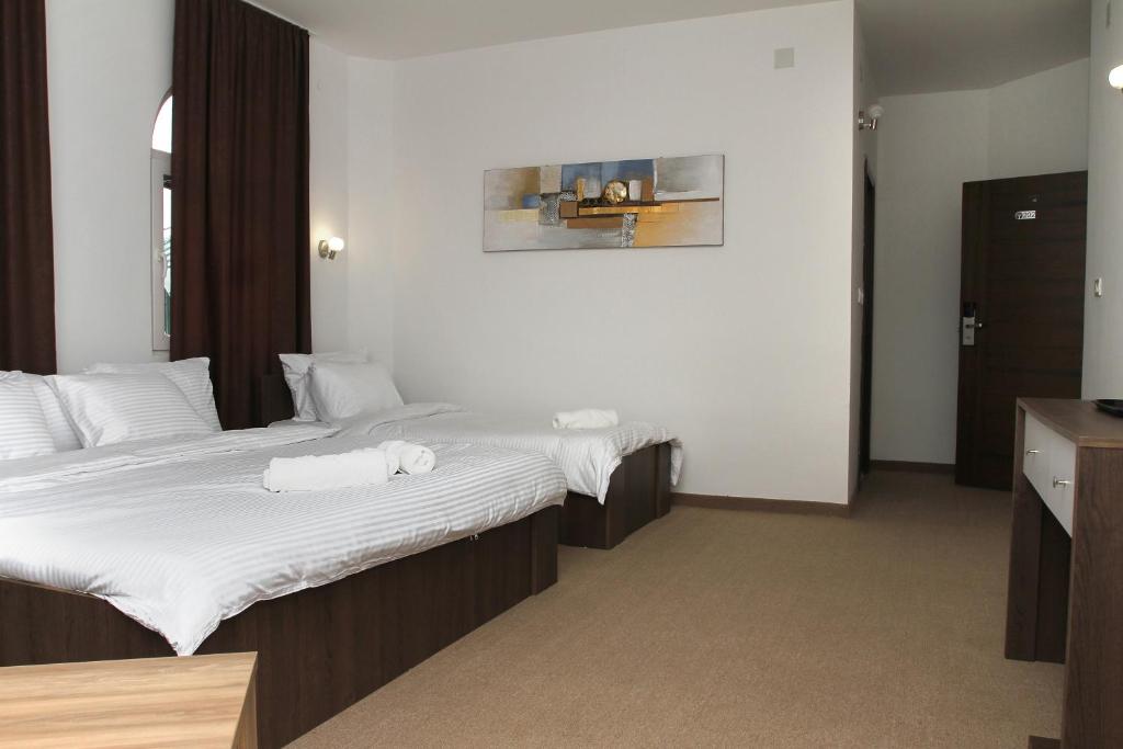 Postel nebo postele na pokoji v ubytování Hotel Andalus