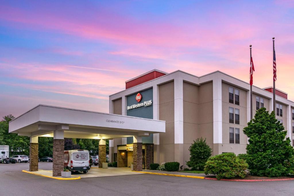 a hotel with a truck parked in front of a building at Best Western Plus Bellingham in Bellingham