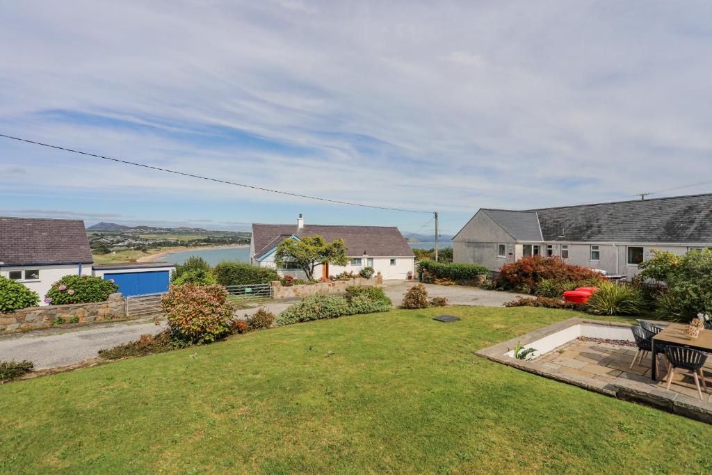a view of the yard of a house at Trem Y Borth Apartment in Abersoch