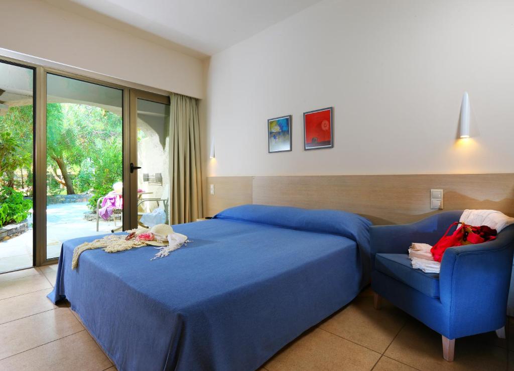 Postel nebo postele na pokoji v ubytování Sitia Beach City Resort & Spa