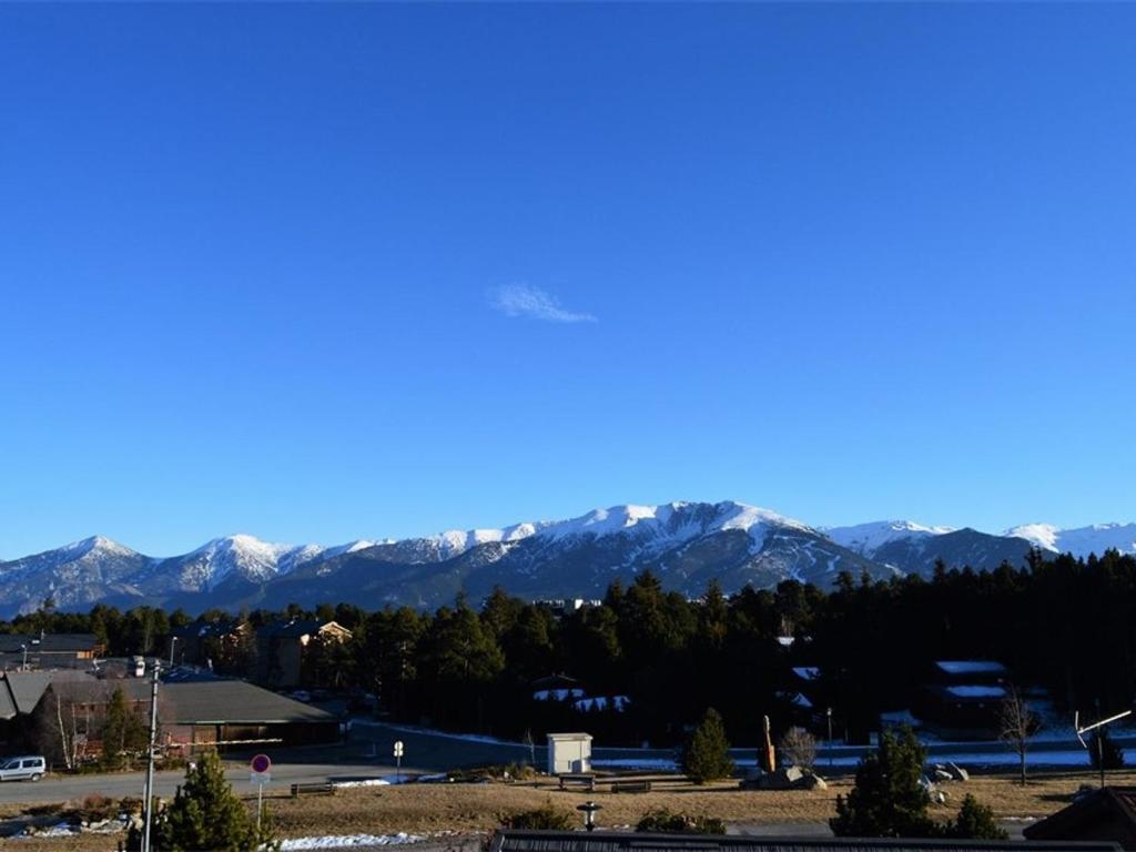 a view of a city with mountains in the background at Appartement Bolquère-Pyrénées 2000, 2 pièces, 7 personnes - FR-1-592-47 in Font-Romeu-Odeillo-Via