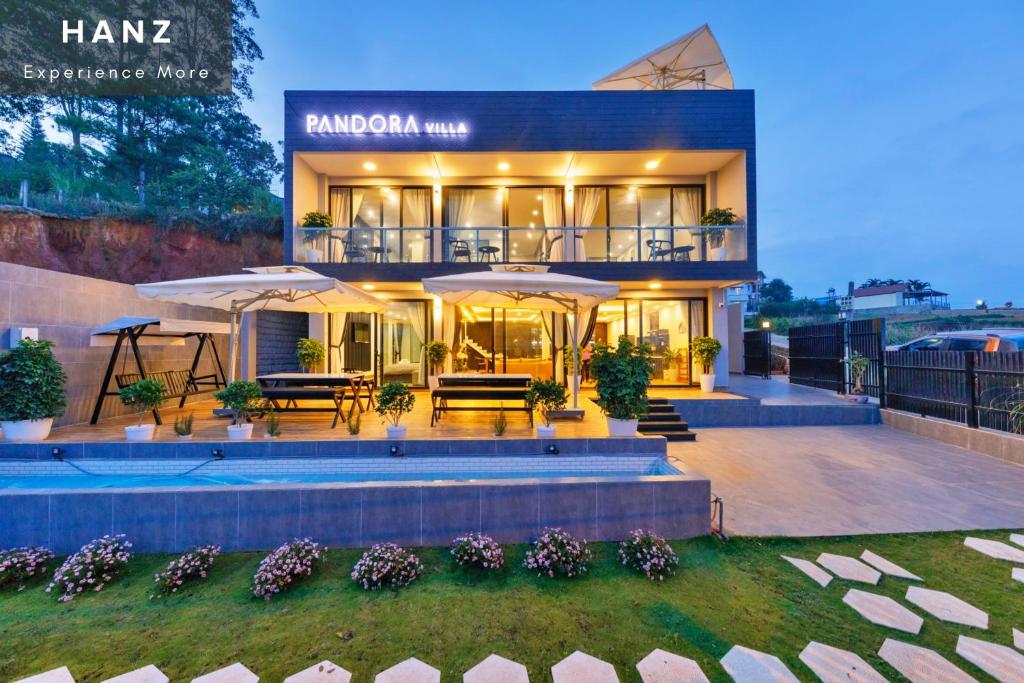 a villa with a swimming pool at night at HANZ Premium Villa Pandora Dalat in Da Thien
