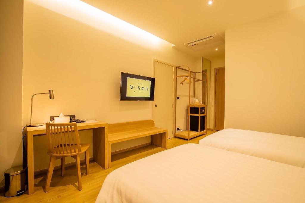 Postel nebo postele na pokoji v ubytování Centara Life Wisma Hotel Ratchaburi