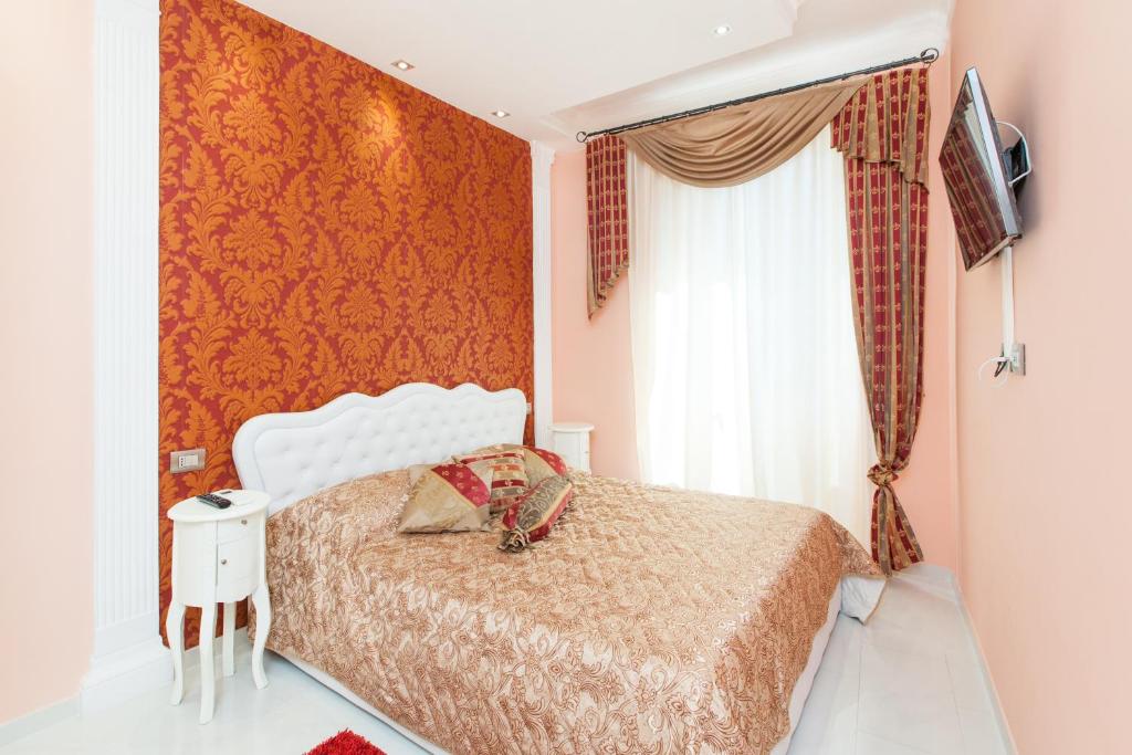 a bedroom with a white bed and a window at Impero Vaticano San Pietro in Rome