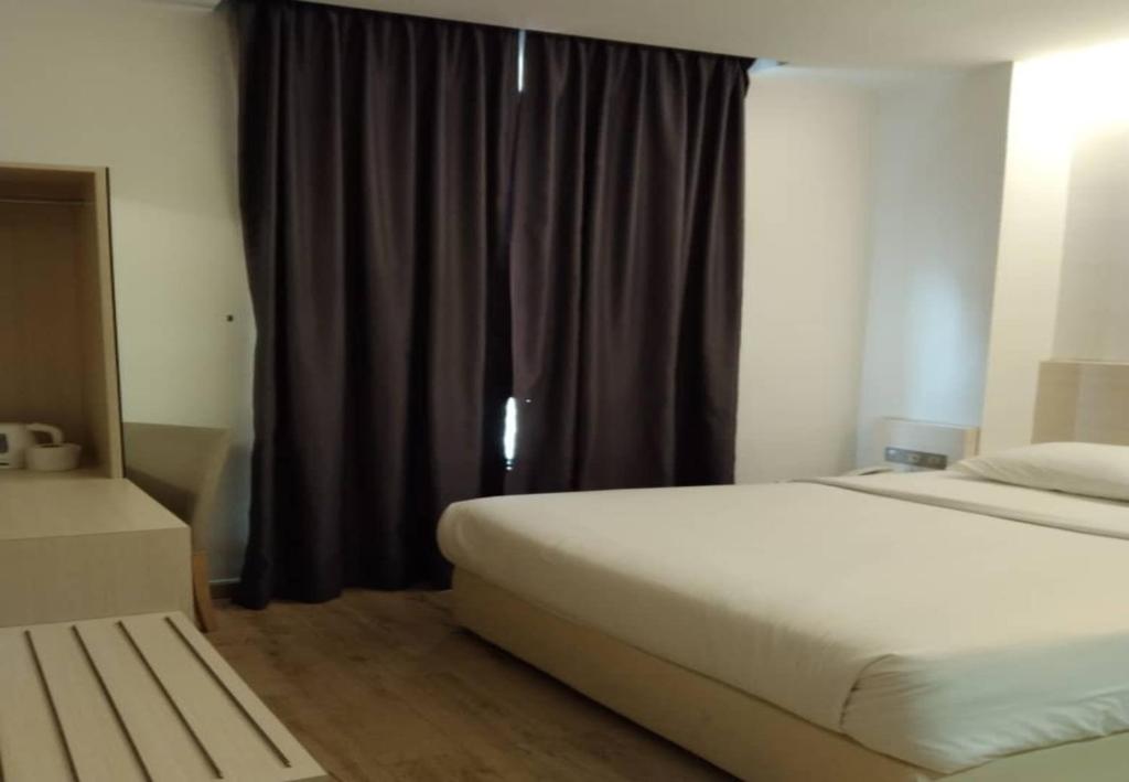 Postel nebo postele na pokoji v ubytování Minimalist Hotel