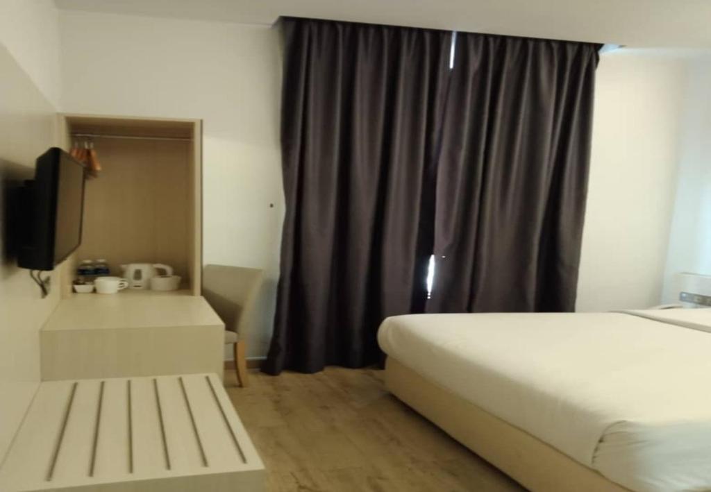 Postel nebo postele na pokoji v ubytování Minimalist Hotel
