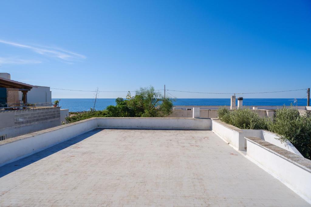 a view of the ocean from the roof of a house at Villa Elena in Porto Cesareo