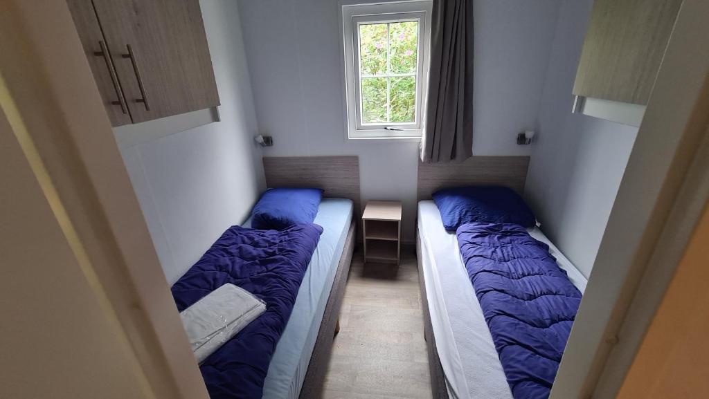 Postel nebo postele na pokoji v ubytování Strand49 Glamping Sint Maartenszee