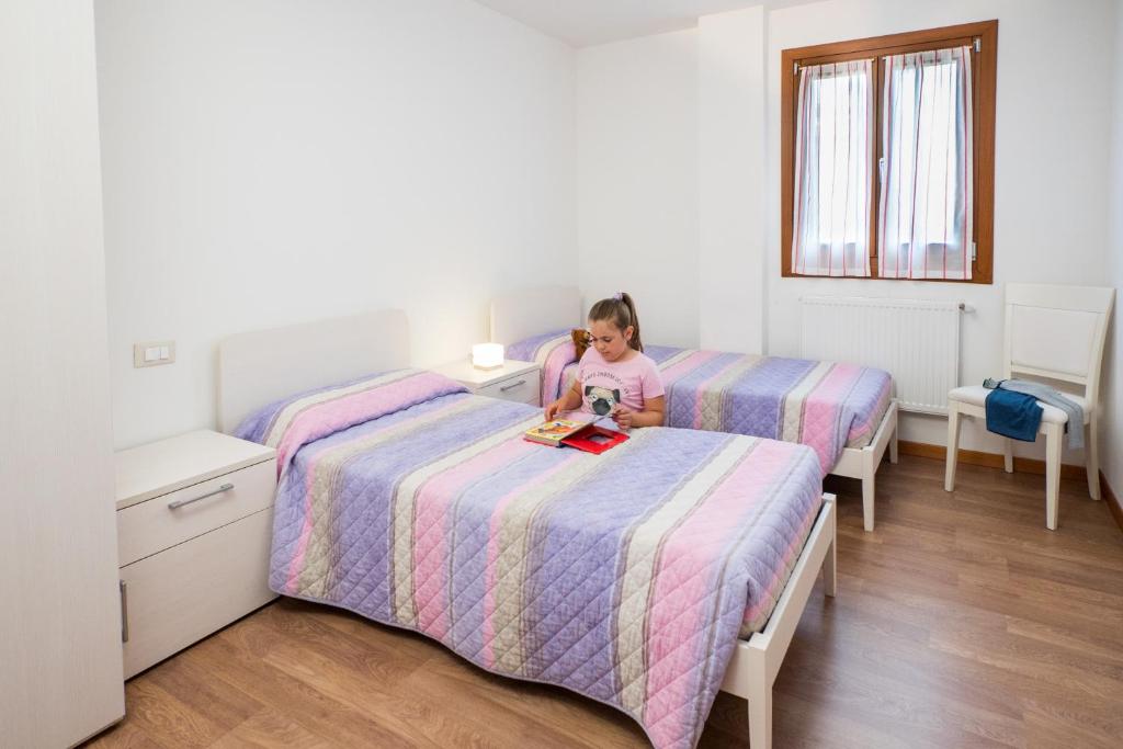 Postel nebo postele na pokoji v ubytování Albergo Diffuso Magredi