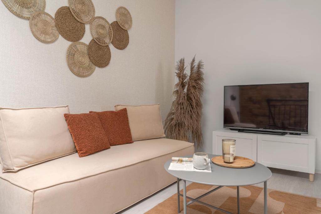 Televízia a/alebo spoločenská miestnosť v ubytovaní HARBOR APARTMENTS - Damrota