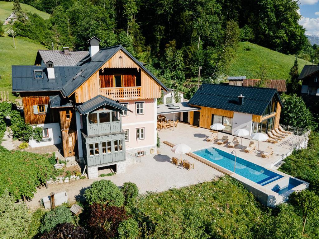 an aerial view of a house with a swimming pool at Villa Flora - a scene for all seasons in Bad Goisern