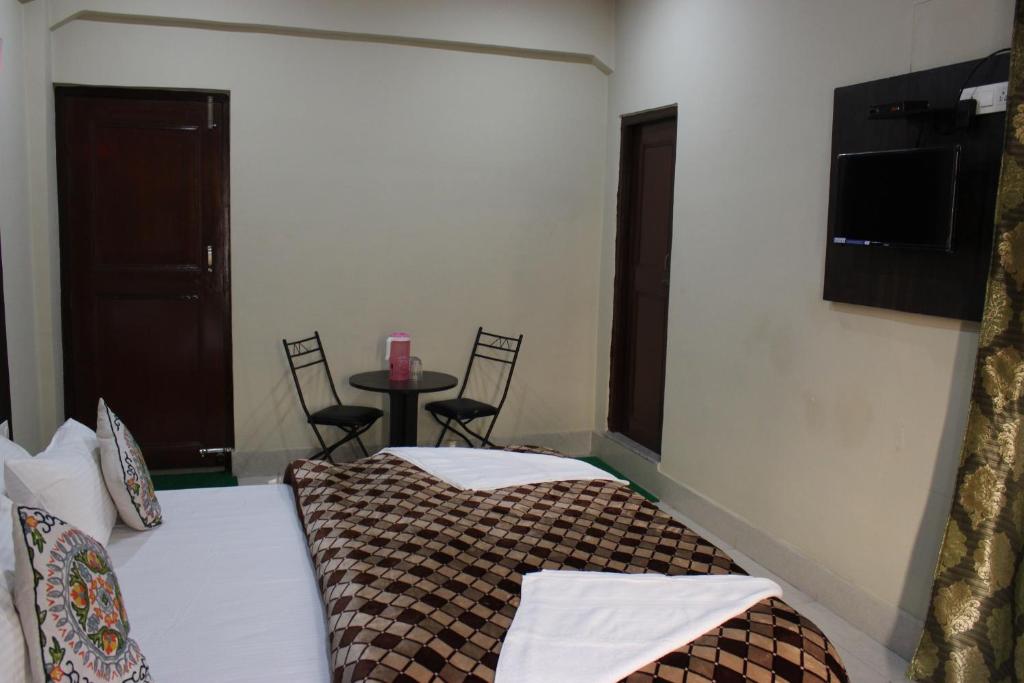 Postel nebo postele na pokoji v ubytování Hotel Samar