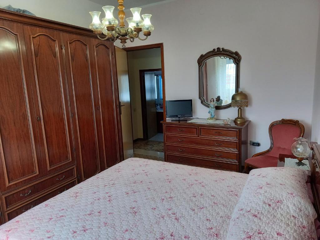 Łóżko lub łóżka w pokoju w obiekcie Casa Blu oltremare