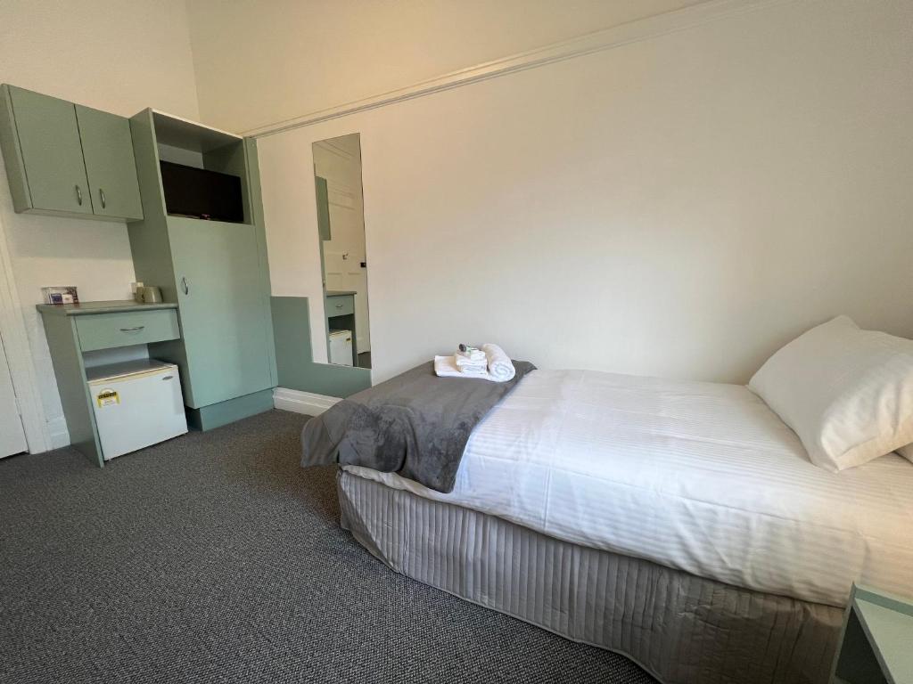 Postel nebo postele na pokoji v ubytování Hotel Concord