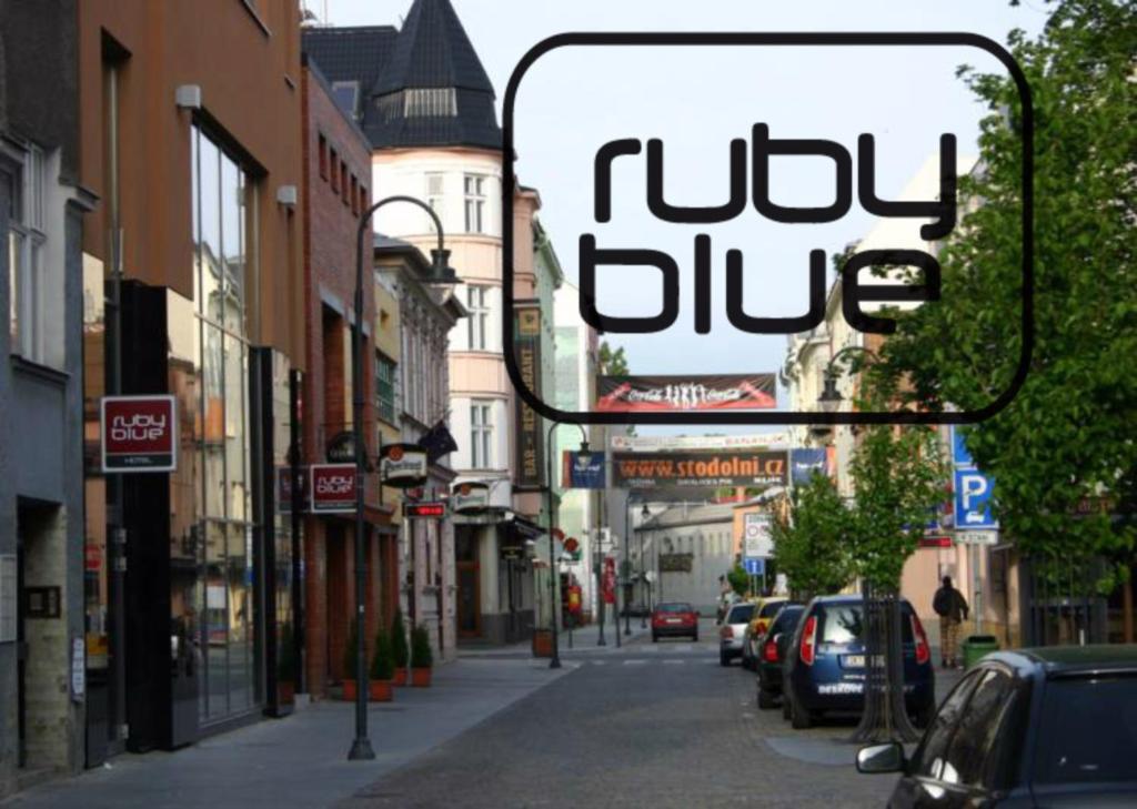 a sign that reads judy blue on a city street at Ruby Blue in Ostrava