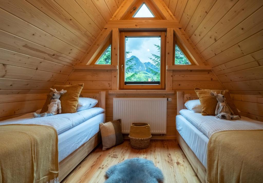 Posteľ alebo postele v izbe v ubytovaní Chaty pod Giewontem