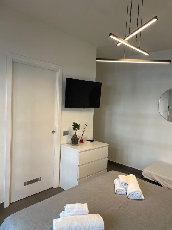 Televízia a/alebo spoločenská miestnosť v ubytovaní Stella Rooms