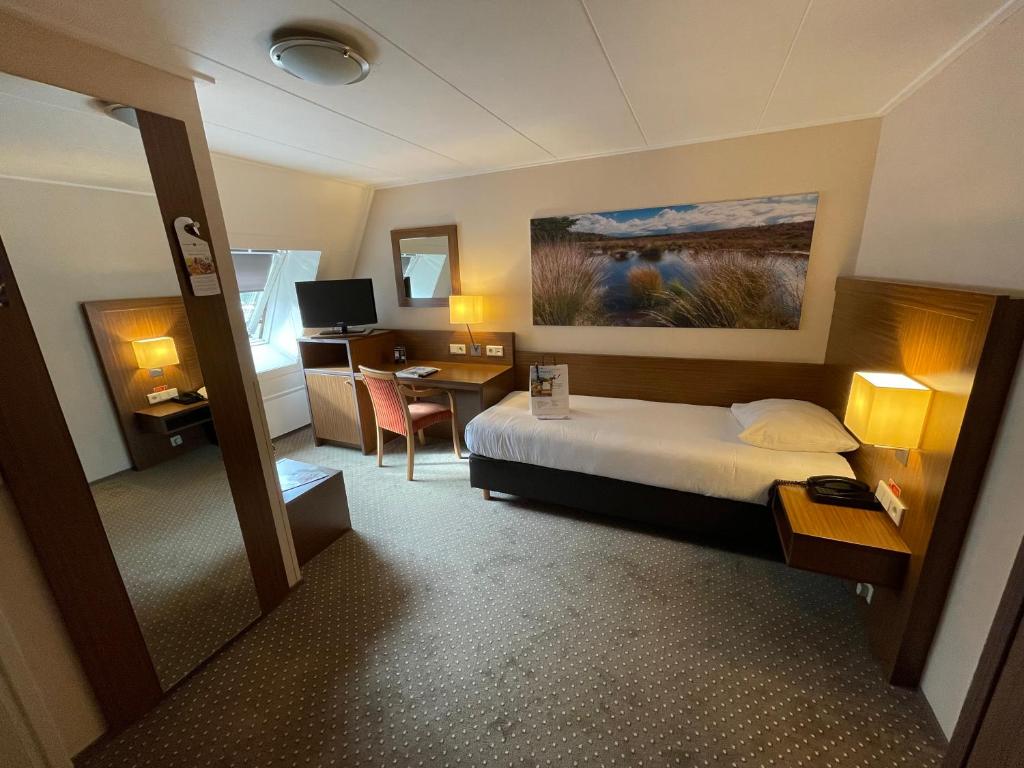 Postel nebo postele na pokoji v ubytování Fletcher Hotel-Restaurant Wolfheze