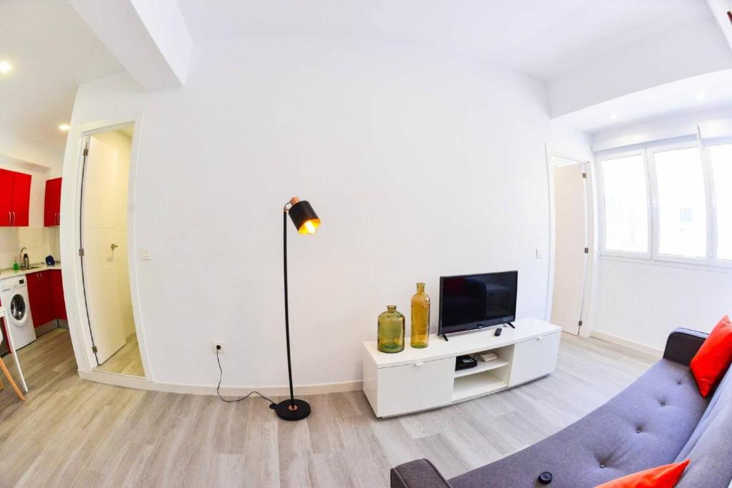 TV a/nebo společenská místnost v ubytování Apartamento Lena