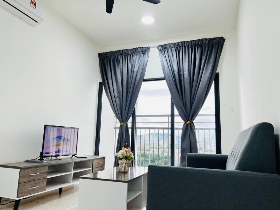 a living room with a couch and a large window at C180 Cheras Traders Square Balakong As Home in Cheras