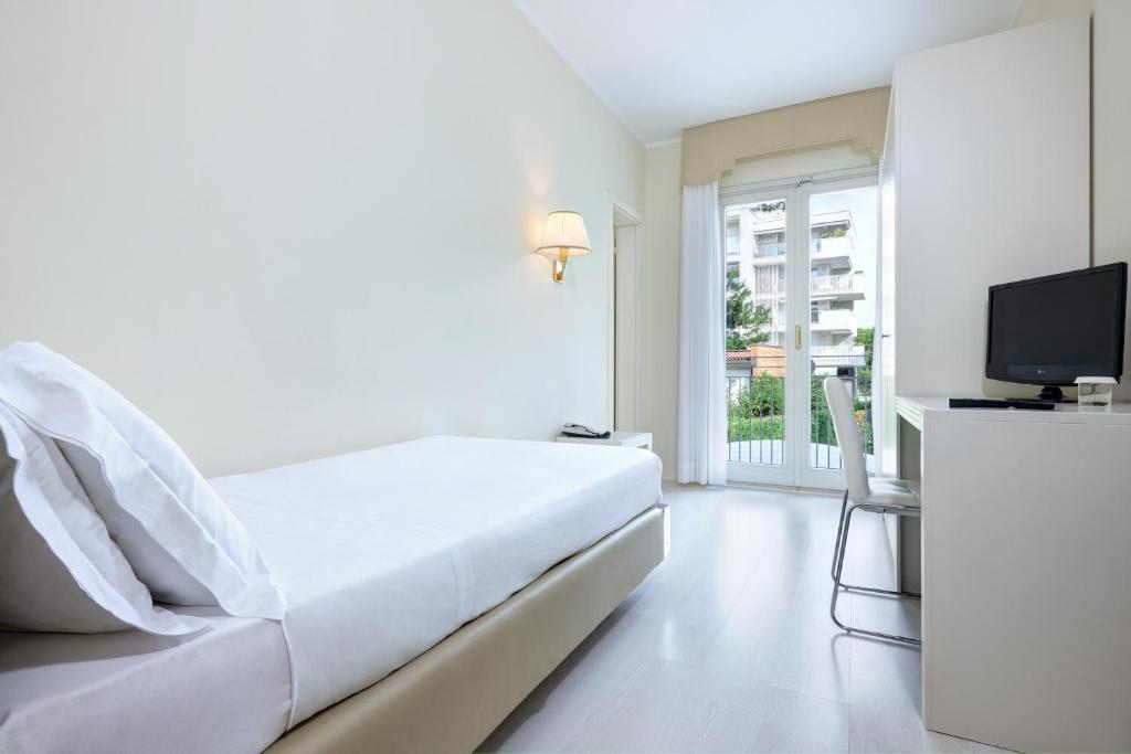 Postel nebo postele na pokoji v ubytování Hotel Gallia & Resort