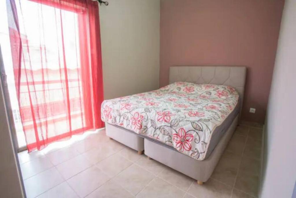 A bed or beds in a room at Vasileiou Apartments