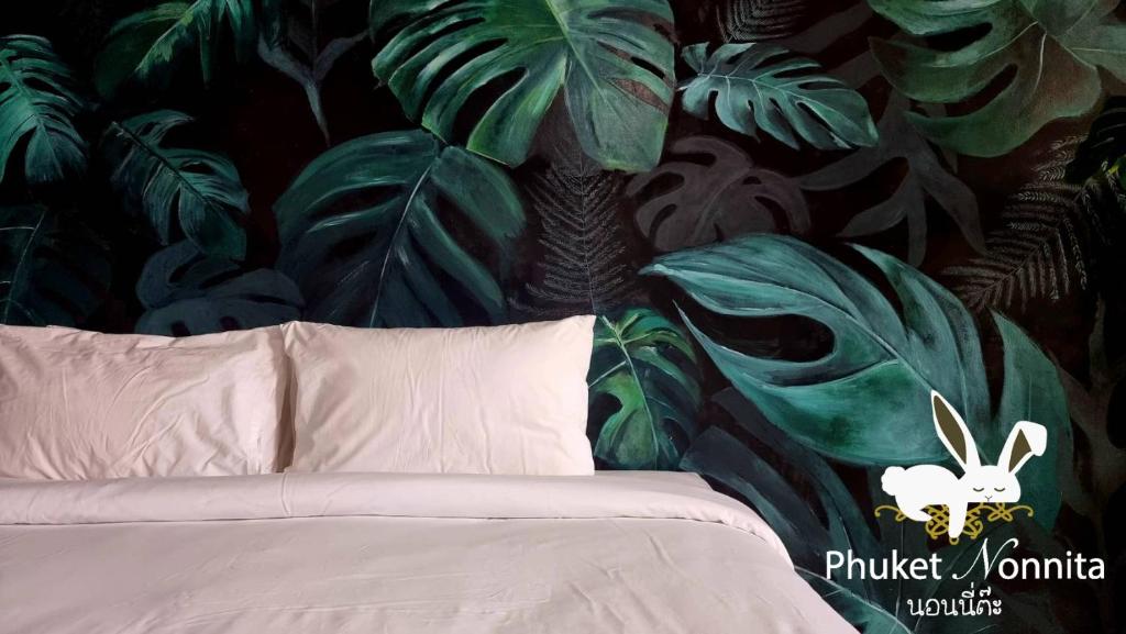 Postel nebo postele na pokoji v ubytování Phuket Nonnita Boutique Resort - SHA Plus