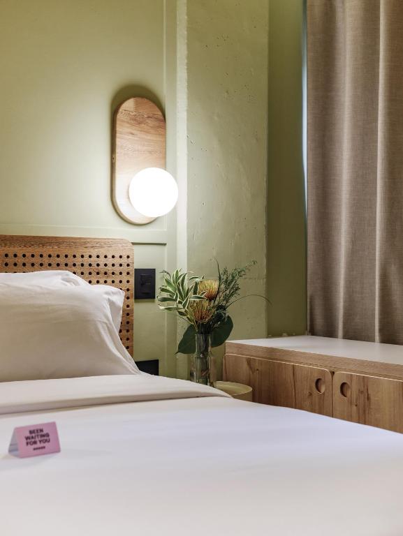 Postel nebo postele na pokoji v ubytování The Somos Flats Provenza