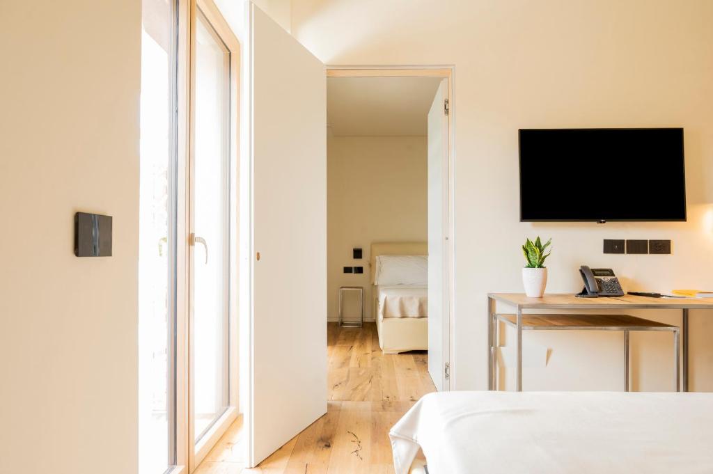 Postel nebo postele na pokoji v ubytování Bihotel